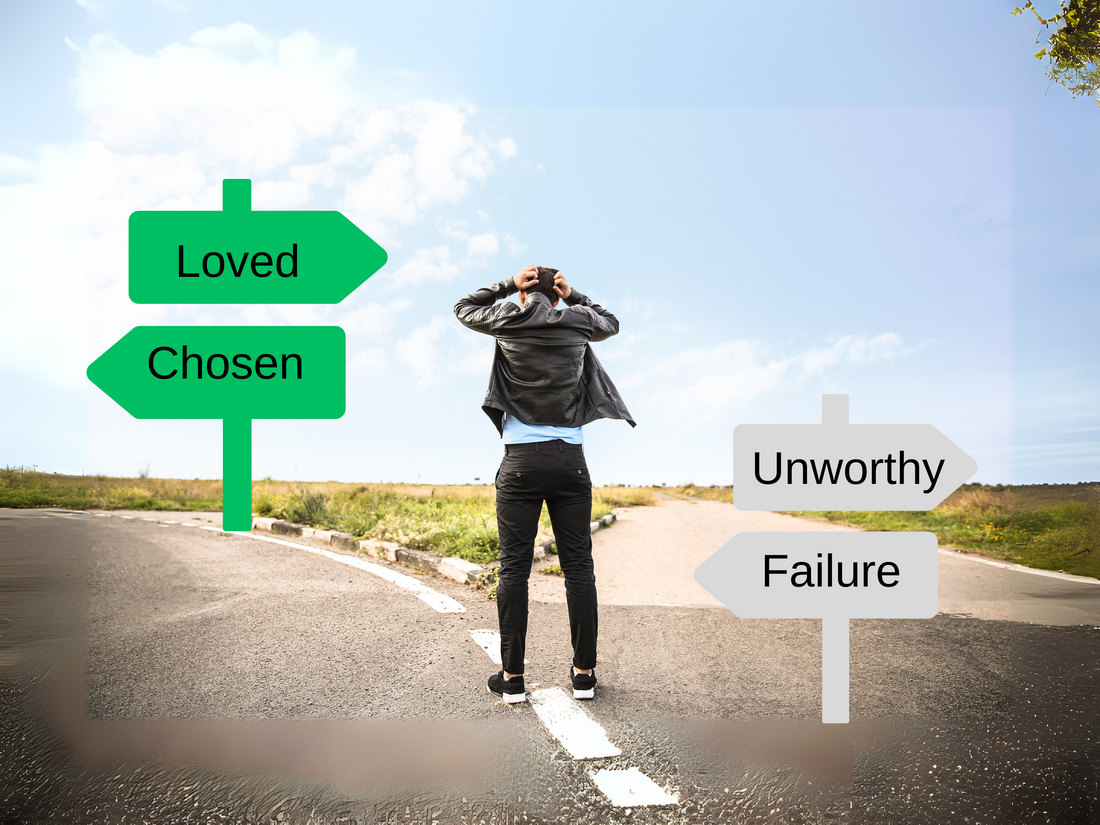 person standing at a crossroad or intersection with labels pointing either way