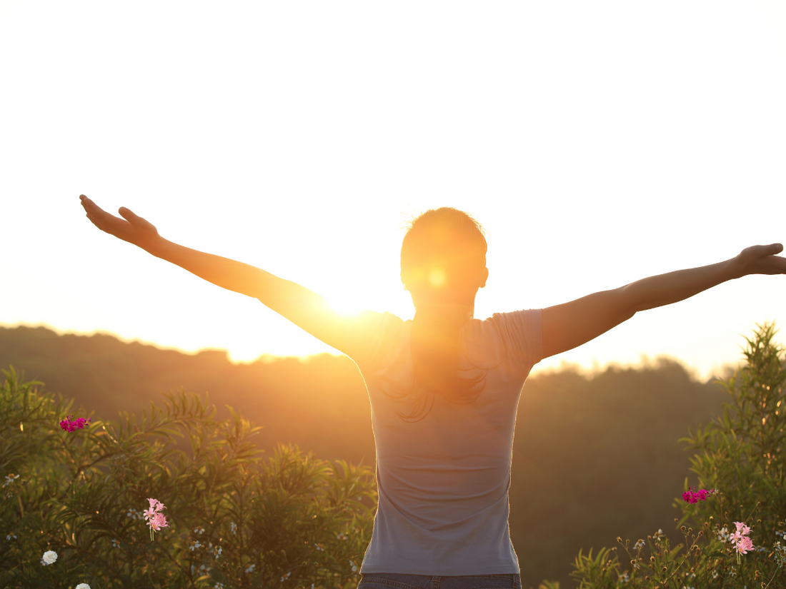 a person standing with arm raise