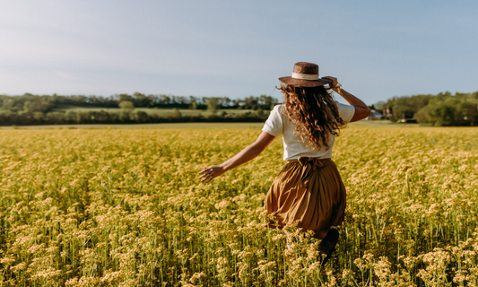 woman standing in an open field