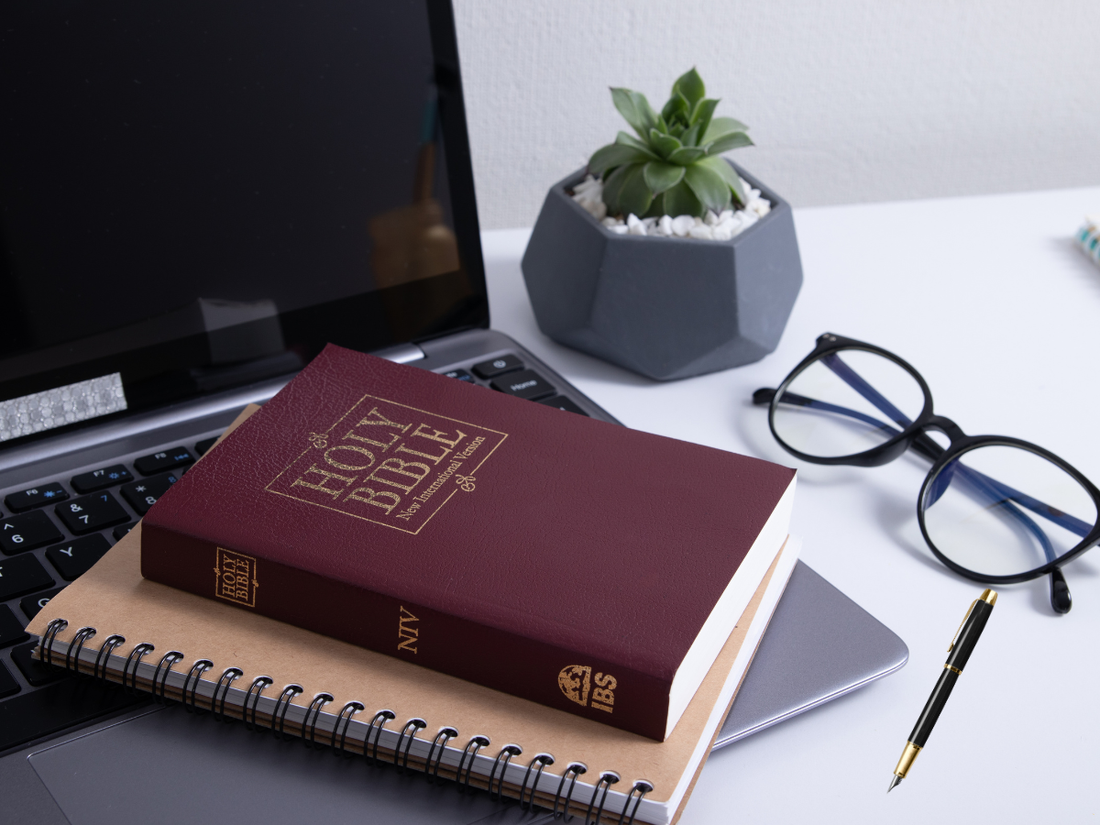 pen Bible and journal in soft natural light—belonging before striving
